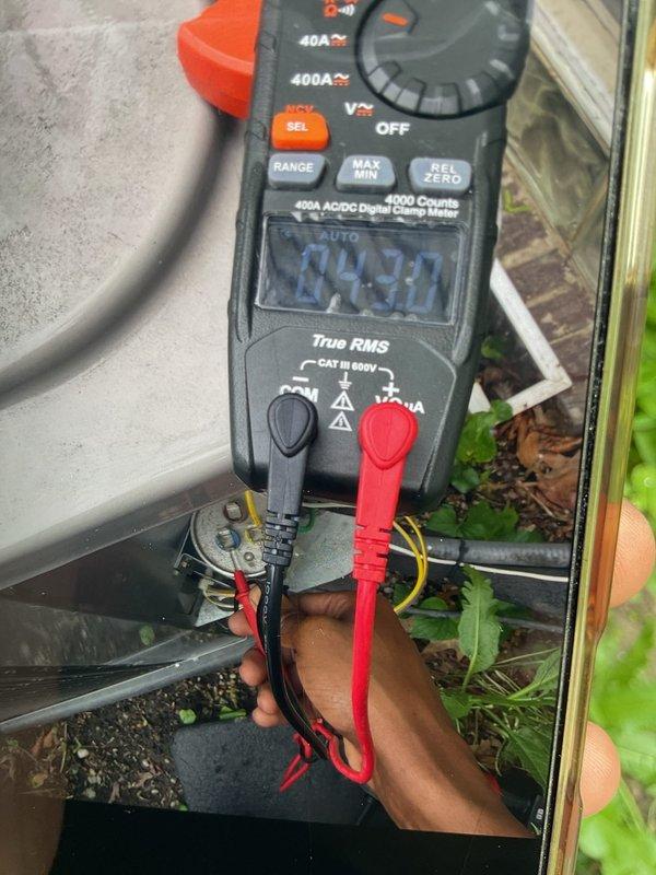 Completed preventive maintenance tune-up on 7-year-old Unico high-velocity air conditioning system with air handler located in attic. Performed comprehensive inspection of Bryant condensing unit, verified electrical connections at disconnect boxes, and measured operating amperage at 24.30A using clamp meter to confirm unit operating within manufacturer specifications. Homeowner reported one radiator not heating properly; system otherwise operational at time of service.
