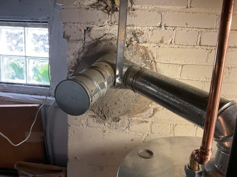 Completed installation of a 50-gallon standard tanked water heater in basement utility area. Installed new copper supply lines with proper compression fittings and valves, including boiler drain connections for future maintenance access. Performed miscellaneous plumbing repairs including securing exposed piping to ceiling joists with appropriate mounting brackets and straps. All connections were properly soldered and tested for leaks. System was commissioned and verified operational upon completion.