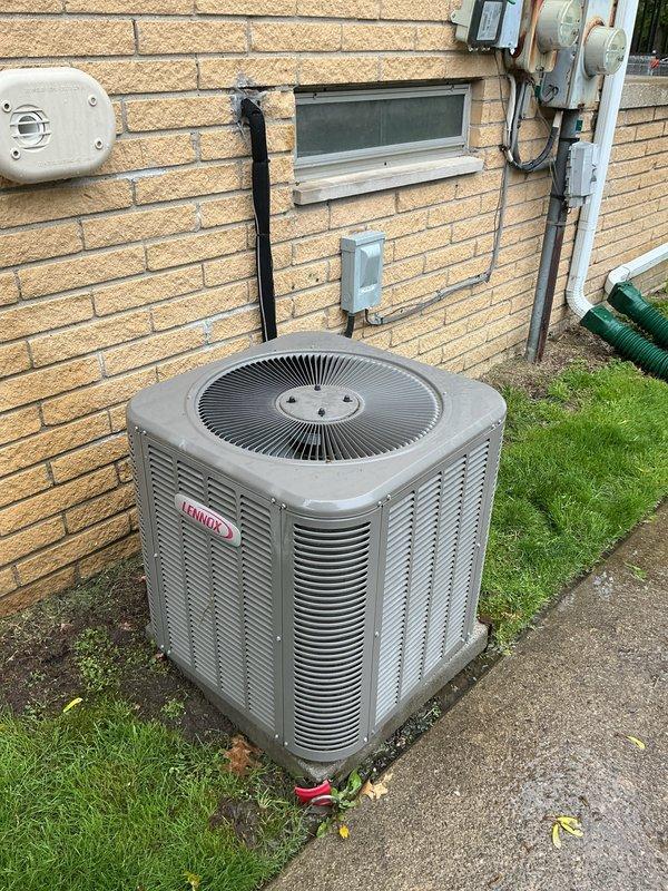 Performed preventive maintenance tune-up on a 9-year-old Lennox AC unit, model 13ACXN024-230A23. System was operational upon arrival and located in exterior side yard on concrete pad. Conducted comprehensive inspection of outdoor condensing unit, verified proper electrical connections at disconnect and meter panel, and documented equipment nameplate specifications including refrigerant charge of HFC-410A at 3 lbs 12 oz. Unit tested and confirmed in proper working condition following tune-up procedures.