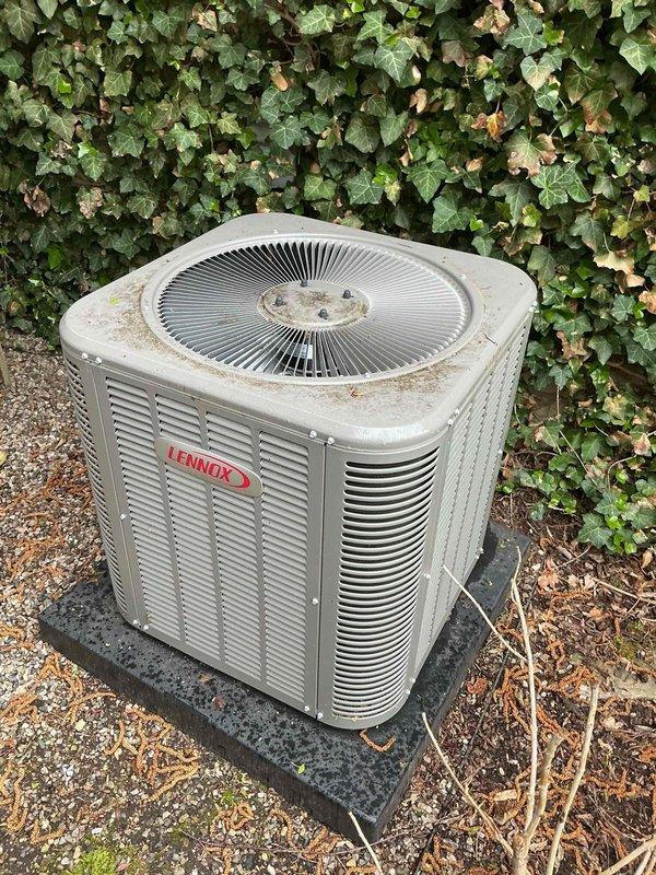 Completed comprehensive Gold AC Inspection and preventative maintenance on a 10-year-old Lennox condensing unit located in backyard installation. Performed full system tune-up including cleaning of condenser coils, removal of accumulated debris and organic matter from unit exterior and top surface, inspection of fan motor and blade assembly, verification of refrigerant levels and pressures, testing of electrical connections and capacitor function, and assessment of overall system performance. Unit showed typical weathering and surface oxidation consistent with age and outdoor exposure but operated within normal parameters. Cleared vegetation and leaf debris from surrounding area to ensure proper airflow and recommended ongoing seasonal maintenance to maximize system efficiency and longevity.