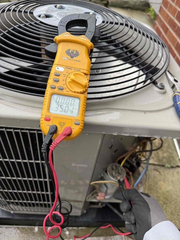 # Gold AC Inspection Summary

Completed comprehensive Gold-level preventive maintenance inspection on 10-year-old residential air conditioning system located in backyard. No operational issues or system deficiencies identified during service visit.

# Work Performed

Conducted thorough electrical diagnostics using digital multimeter at outdoor disconnect panel, verifying proper voltage readings and electrical connections. Measured incoming line voltage at 235.0V and confirmed amperage draw of 40.40A at condenser unit, both within manufacturer specifications for system age and capacity.

Inspected condensing unit components including compressor operation, fan motor performance, and refrigerant pressures. Verified proper fan blade rotation and airflow through condenser coil. Examined electrical connections at outdoor disconnect box, checking wire integrity and terminal tightness. All wiring showed appropriate color coding and secure connections within junction box.

Performed visual insp