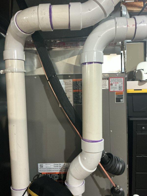 Completed air conditioning system startup for newly installed basement evaporator coil. Verified proper refrigerant line connections, condensate drainage system operation with PVC piping and condensate pump, and confirmed all electrical connections to control components. System tested and operating within manufacturer specifications with adequate airflow and drainage functioning correctly.