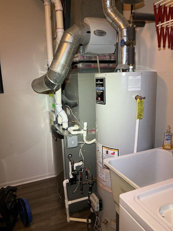 Completed comprehensive Gold AC Inspection of residential HVAC system, including evaluation of Lennox furnace unit with integrated humidifier and ductwork components. Verified thermostat operation displaying proper temperature readings at 71°F, confirmed all system controls functioning correctly, and documented equipment condition with no immediate service concerns identified.