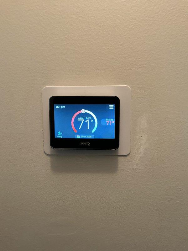 Completed comprehensive Gold AC Inspection of residential HVAC system, including evaluation of Lennox furnace unit with integrated humidifier and ductwork components. Verified thermostat operation displaying proper temperature readings at 71°F, confirmed all system controls functioning correctly, and documented equipment condition with no immediate service concerns identified.