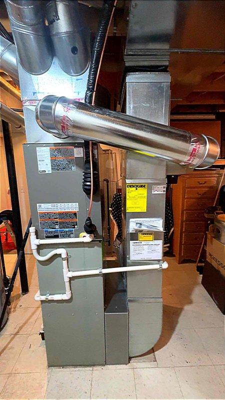 Completed installation of new air conditioning system and evaporator coil in residential basement utility area. System was properly connected to existing furnace, all ductwork secured and sealed, condensate drainage lines installed, and electrical connections completed per manufacturer specifications. Unit tested and verified operational, permit requested for final inspection.