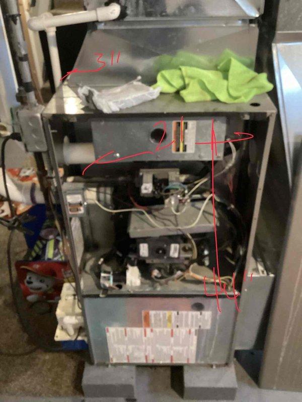 Responded to service call for 20-year-old Carrier furnace model 58MVB080-14 displaying 4-1-1 error code with complete system shutdown and no heating capability. Performed diagnostic evaluation and identified failed inducer motor as primary issue preventing unit operation. Due to age of equipment and high repair costs exceeding economical threshold, along with unconfirmed condition of heat exchanger, provided comprehensive replacement estimate for new furnace system. Documented existing unit configuration, photographed internal components and installation setup including ductwork connections and PVC venting system to facilitate accurate equipment sizing and replacement planning.