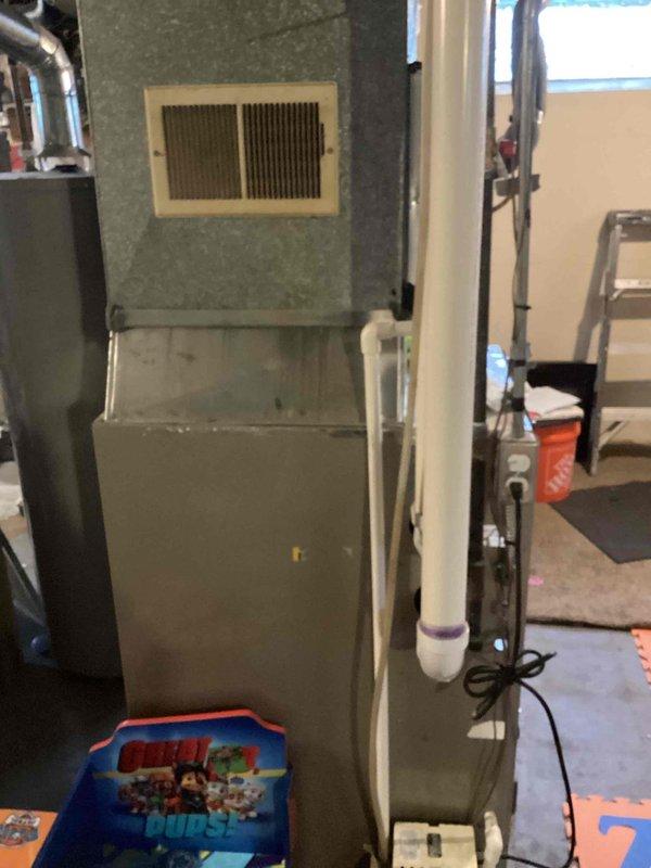 Responded to service call for 20-year-old Carrier furnace model 58MVB080-14 displaying 4-1-1 error code with complete system shutdown and no heating capability. Performed diagnostic evaluation and identified failed inducer motor as primary issue preventing unit operation. Due to age of equipment and high repair costs exceeding economical threshold, along with unconfirmed condition of heat exchanger, provided comprehensive replacement estimate for new furnace system. Documented existing unit configuration, photographed internal components and installation setup including ductwork connections and PVC venting system to facilitate accurate equipment sizing and replacement planning.
