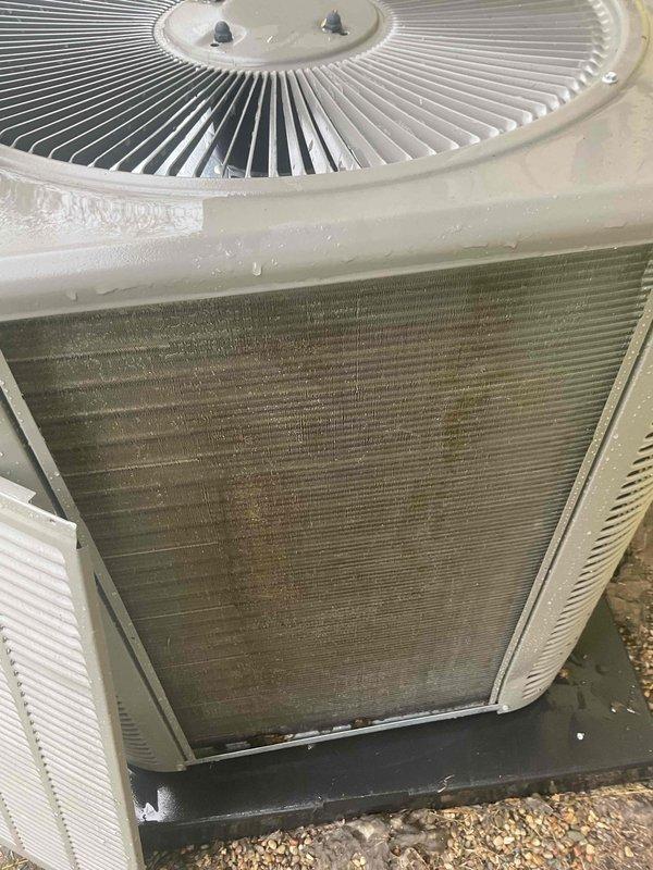 Completed comprehensive Gold AC inspection on residential HVAC system less than one year old with air handler located in utility room. Installed four new air filters, inspected electrical components including capacitor and wiring connections which were found to be in good working order, and documented outdoor condenser unit showing significant dirt accumulation and discoloration on coil fins requiring future cleaning attention. All system components tested and operational at time of inspection.