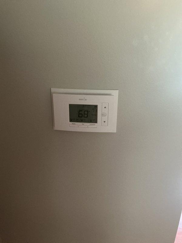 Completed full HVAC system installation including 90,000 BTU furnace and 3.5-ton air conditioning unit with rear discharge configuration. Obtained mechanical and electrical permits, installed new electrical disconnect and circuit protection at panel, ran conduit for power supply, and connected all components to code. Installed Sensi digital thermostat, verified proper system operation, and completed utility rebate documentation for Consumers Energy and DTE Energy programs with AHRI certificate number 21558593.
