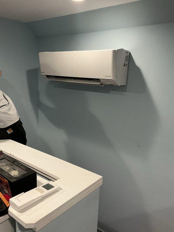 Completed full mini-split system replacement with mechanical and electrical permits obtained. Installed new Daikin ductless indoor wall unit in conditioned space with corresponding outdoor condensing unit, routed refrigerant lines and electrical connections through attic space, and reconnected all electrical components per code requirements. System tested and verified operational upon completion.