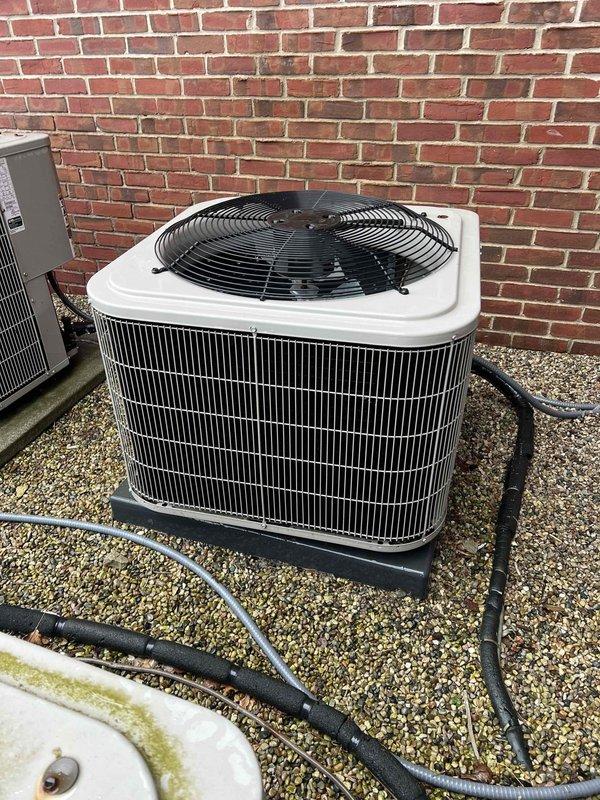 Completed comprehensive HVAC tune-up on a 4-year-old system with air handler located in utility room and outdoor condensing unit. Performed thorough inspection of all system components including thermostat calibration, humidifier operation check, and hot water tank assessment. System found operating within normal parameters with all components functioning properly; documented equipment condition with photos for service records.