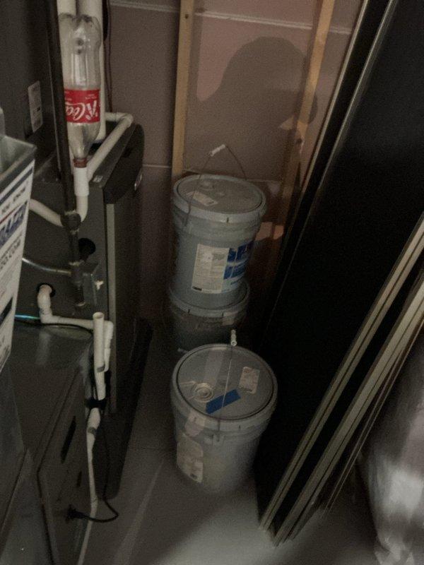 Completed comprehensive air conditioning inspection and tune-up service on residential HVAC system located in basement utility area. System evaluated and found to be operating within normal parameters; all mechanical components, ductwork, and drain lines inspected with no immediate service needs identified.