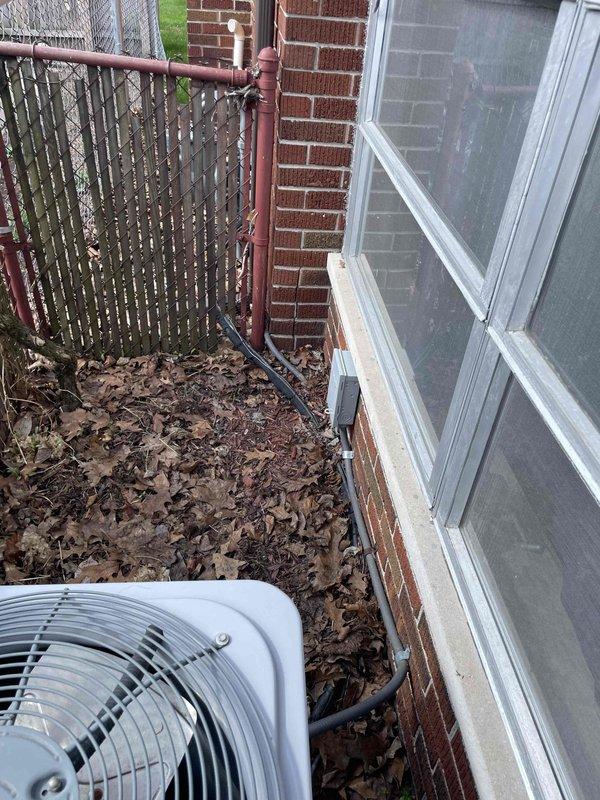 Completed comprehensive estimate for air conditioning system replacement and AC/media cabinet installation at residential property with existing 10-year-old furnace located in basement. Evaluated current outdoor condensing unit positioned along brick exterior foundation and assessed indoor thermostat controls currently set to heating mode at 70 degrees. Provided detailed replacement options and specifications for new AC system compatible with existing furnace infrastructure.
