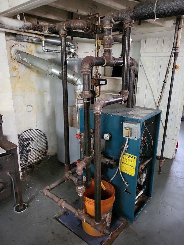 Responded to service call for steam boiler with pilot light failure. Upon inspection, determined thermocouple was defective and heat exchanger exhibited cracking. Successfully relit pilot during diagnostic evaluation, but unit failed to maintain flame due to faulty thermocouple safety device. Given the age of the equipment (10+ years) and the compromised condition of the heat exchanger, provided estimate for boiler replacement as the heat exchanger damage presents a safety concern and repair is not cost-effective for equipment of this age.