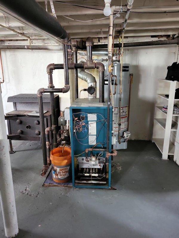 Responded to service call for steam boiler with pilot light failure. Upon inspection, determined thermocouple was defective and heat exchanger exhibited cracking. Successfully relit pilot during diagnostic evaluation, but unit failed to maintain flame due to faulty thermocouple safety device. Given the age of the equipment (10+ years) and the compromised condition of the heat exchanger, provided estimate for boiler replacement as the heat exchanger damage presents a safety concern and repair is not cost-effective for equipment of this age.