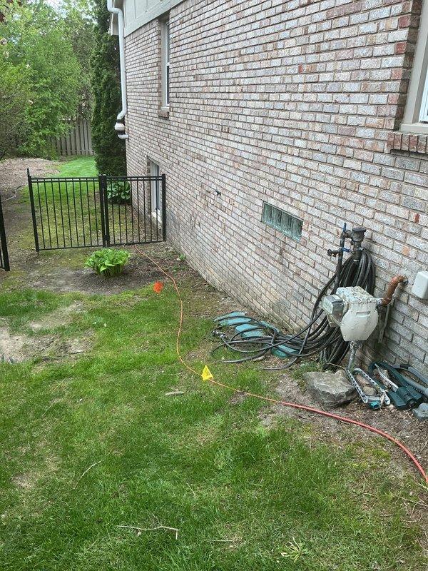 Conducted on-site assessment for new gas line installation at residential property. Evaluated existing utility infrastructure including outdoor plumbing connections, gas meter location, and potential routing paths along exterior brick wall. Documented current conditions of mechanical equipment area, identified optimal placement for new gas line run, and provided comprehensive quote for installation work. Photographed existing utility setup and proposed installation area for project planning purposes.