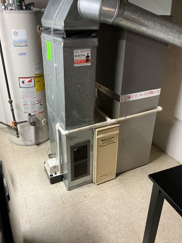 Completed installation of 3-ton air conditioning system with matching evaporator coil in residential utility room. Installed new air handler unit with proper electrical connections and ductwork integration, performed system flush, and reconnected all components to existing infrastructure. Obtained mechanical and electrical permits, verified all safety labels and technical specifications are properly displayed, ensured proper refrigerant charge levels, and tested system operation to confirm optimal performance and compliance with manufacturer specifications.
