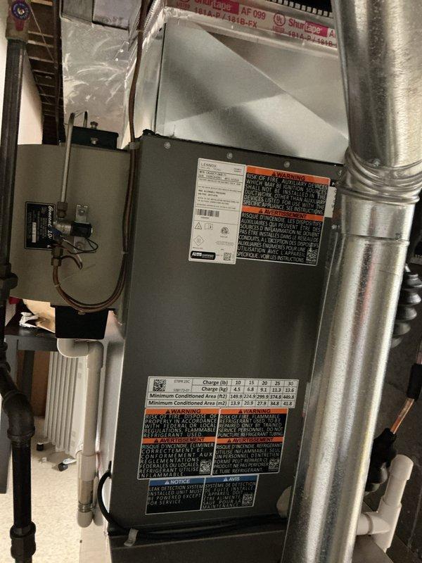 Completed installation of 3-ton air conditioning system with matching evaporator coil in residential utility room. Installed new air handler unit with proper electrical connections and ductwork integration, performed system flush, and reconnected all components to existing infrastructure. Obtained mechanical and electrical permits, verified all safety labels and technical specifications are properly displayed, ensured proper refrigerant charge levels, and tested system operation to confirm optimal performance and compliance with manufacturer specifications.