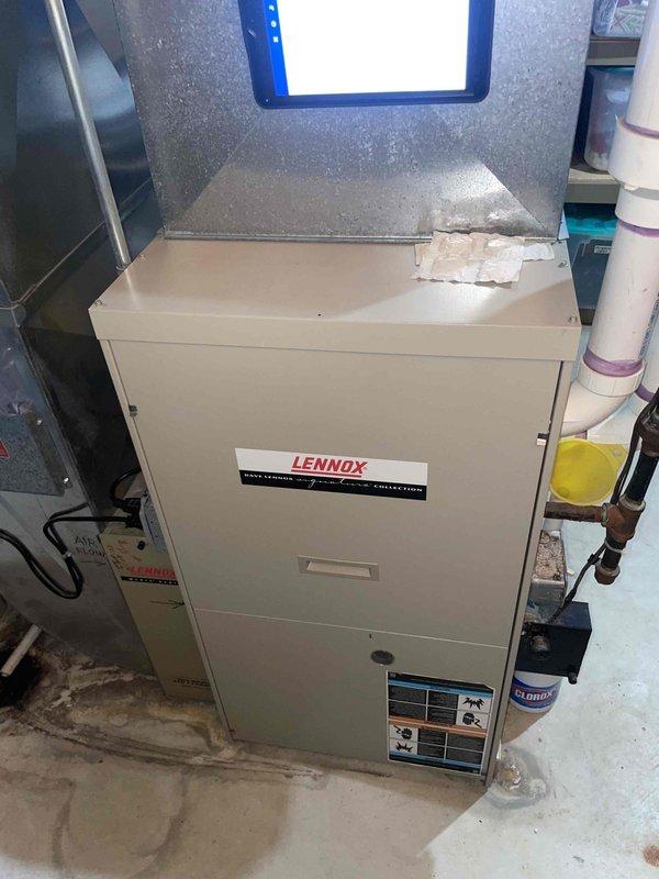 Conducted comprehensive assessment of existing 22-year-old Lennox furnace and air conditioning system for replacement estimate. Documented current basement-installed heating unit, outdoor condensing unit, existing ductwork configuration, and integrated humidification system. Evaluated equipment condition, measured system specifications, photographed installation layout including copper refrigerant lines, electrical connections, and ventilation components to provide accurate replacement recommendations for complete HVAC system upgrade.