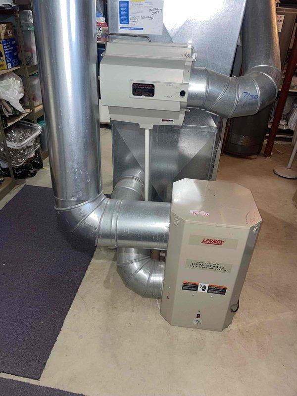 Conducted comprehensive assessment of existing 22-year-old Lennox furnace and air conditioning system for replacement estimate. Documented current basement-installed heating unit, outdoor condensing unit, existing ductwork configuration, and integrated humidification system. Evaluated equipment condition, measured system specifications, photographed installation layout including copper refrigerant lines, electrical connections, and ventilation components to provide accurate replacement recommendations for complete HVAC system upgrade.