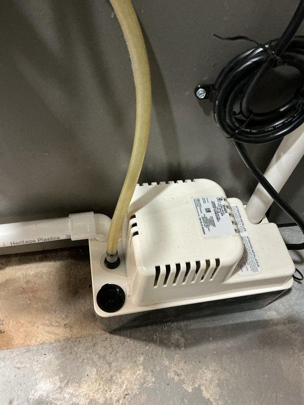 Completed installation of 3-ton Lennox air conditioning system with matching evaporator coil in left-side configuration. Installed new condensate pump with drainage line, programmable thermostat with decorative wall plate, and reconnected all electrical and refrigerant lines to specifications. System tested and verified operational with proper airflow and cooling performance.