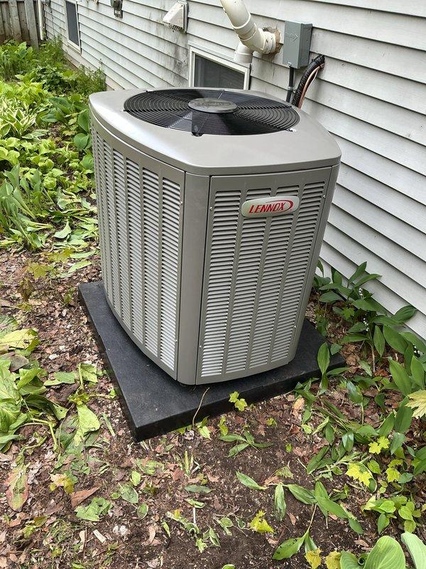 Completed installation of 3-ton Lennox air conditioning system with matching evaporator coil in left-side configuration. Installed new condensate pump with drainage line, programmable thermostat with decorative wall plate, and reconnected all electrical and refrigerant lines to specifications. System tested and verified operational with proper airflow and cooling performance.