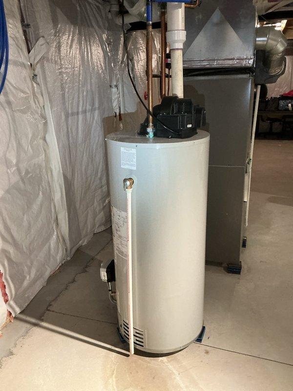 Responded to service call for 5-year-old water heater not providing hot water to master bathroom and leaking valve. Installed new Flame 10/10 warranty tank water heater in basement utility area. Completed all necessary copper piping connections and ensured proper installation on concrete floor. Verified hot water delivery to all fixtures including master bathroom faucet. System tested and confirmed operational with no leaks detected.