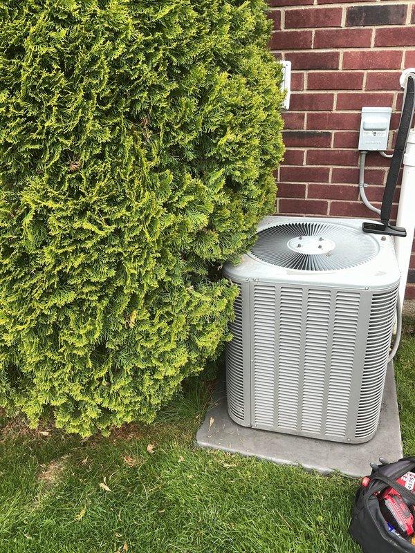 Completed preventive maintenance tune-up on 10+ year old residential air conditioning system with coil located in basement. Performed comprehensive inspection of outdoor condenser unit, verified proper operation of fan motor and compressor, checked refrigerant lines and electrical connections at disconnect box. Unit found in normal operating condition with minor surface weathering; all components functioning within manufacturer specifications.