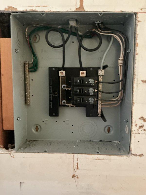 Performed comprehensive electrical assessment for electric vehicle charging station installation feasibility, evaluated existing electrical panel condition and capacity, and conducted whole home electrical system inspection. Documented current meter configuration, exterior service entrance components, and interior panel with existing circuit breaker arrangement to determine necessary upgrades for EV charger integration. Provided detailed analysis and recommendations for main electrical panel replacement to support increased load requirements.