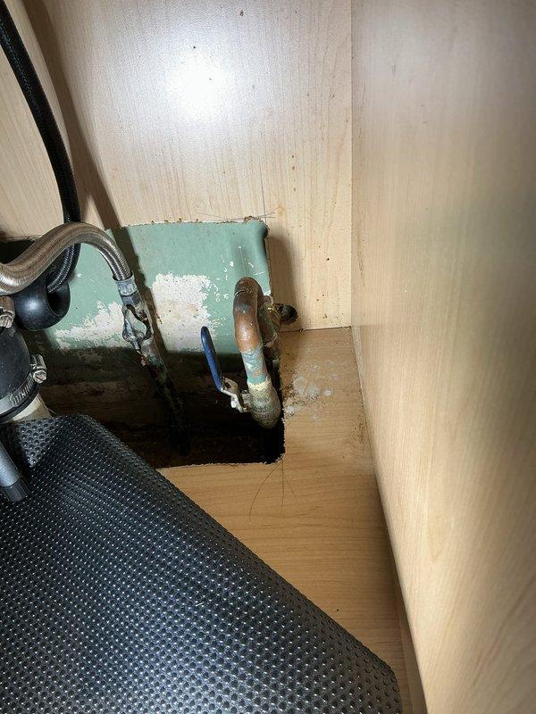 Responded to service call for leaking outdoor water spigot at rear of property. Upon inspection, identified deteriorated hose bib with compromised valve seat and worn packing causing active water seepage at connection point. Shut off water supply at interior shutoff valve located beneath adjacent fixture. Removed existing weathered brass hose bib from exterior wall penetration, inspected copper supply line for corrosion or damage, and confirmed integrity of pipe threading. Installed new frost-proof hose bib with anti-siphon vacuum breaker, applied appropriate thread sealant to ensure watertight connection, and secured mounting flange to siding. Restored water supply, tested valve operation through multiple open/close cycles, and verified complete elimination of leak at spout and wall connection. Confirmed proper drainage and functionality before completion.