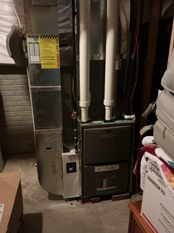 Completed comprehensive Gold AC Inspection on 12-year-old Lennox HVAC system located in basement. Performed full system evaluation including inspection of air handler, evaporator coil, condensate drainage, electrical connections, and refrigerant lines. Examined and documented air filter condition, noting pleated filter media with accumulated dust and particulate matter requiring replacement. Verified proper operation of all system components, checked airflow, and confirmed equipment is functioning within normal parameters. System operational and homeowner advised of maintenance findings.