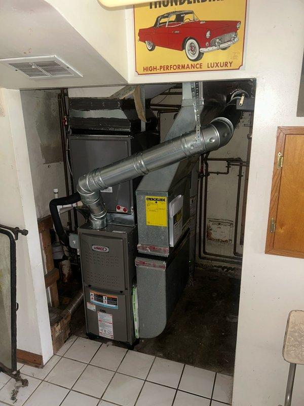 Returned to complete chimney liner installation that was deferred from winter HVAC system install. Replaced existing thermostat with customer's original unit per homeowner request, ensuring proper wiring connections and system compatibility with the Lennox furnace.