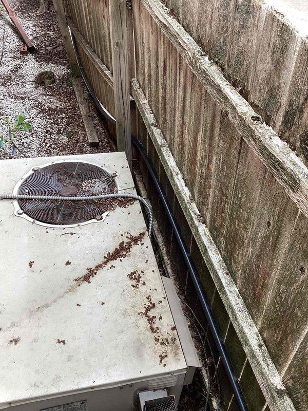 Completed estimate for furnace replacement at residential property. Existing outdoor HVAC condenser unit shows significant weathering, corrosion on fan grille, and debris accumulation, positioned on concrete pad against privacy fence in narrow side yard access area. Assessed electrical panel configuration with 225A main breaker to verify compatibility for new furnace installation. Previous furnace unit was originally installed by another contractor, with current maintenance contract extending through 2026. Documented existing equipment condition and electrical infrastructure via photographs for replacement proposal. Replacement unit will be installed at same side-of-house location as existing furnace.
