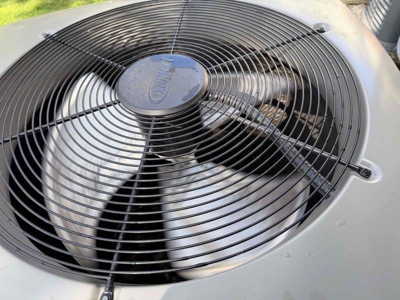 Completed comprehensive Gold AC inspection on single-zone residential air conditioning system with basement-located air handler. Performed airside diagnostics confirming system operating within optimal parameters with 21.9°F temperature split between return air (64.6°F) and supply air (42.7°F), indicating proper refrigerant charge and heat exchange efficiency. Inspected outdoor condenser unit, verified fan operation, and documented equipment condition with system functioning properly at time of inspection.