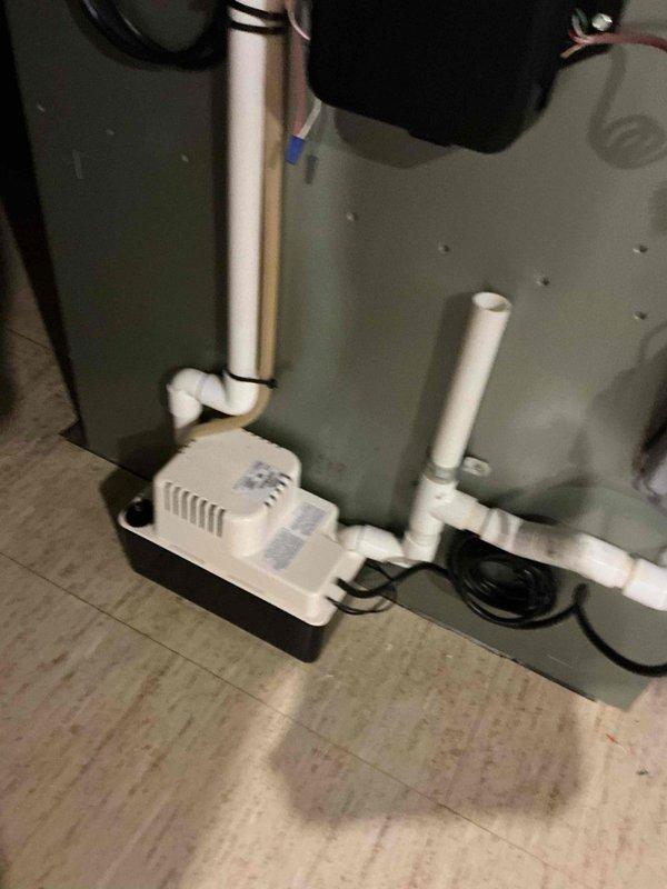 Completed full HVAC system installation including new air conditioning unit and evaporator coil. Installed condensate pump with white PVC drain lines and proper drain pan for moisture management. Ran and secured refrigerant lines with appropriate insulation and mounting hardware. Connected electrical wiring and power supply to all components. Verified all connections, tested system operation, and confirmed proper drainage from condensate pump. Installation included APCO air purification system integration. Permit was requested for the installation work. System checked and confirmed operational upon completion.