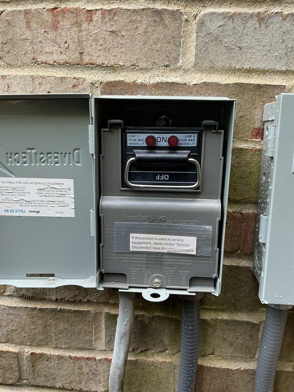 Completed Gold Plan AC inspection on residential outdoor condensing unit. Performed comprehensive tune-up including visual inspection of electrical disconnect box and meter installation, verified proper operation of service disconnect switch, inspected outdoor unit fan assembly and protective guard for proper clearance and condition, and documented equipment status with photos. All components found operating within normal parameters with no immediate service needs identified.