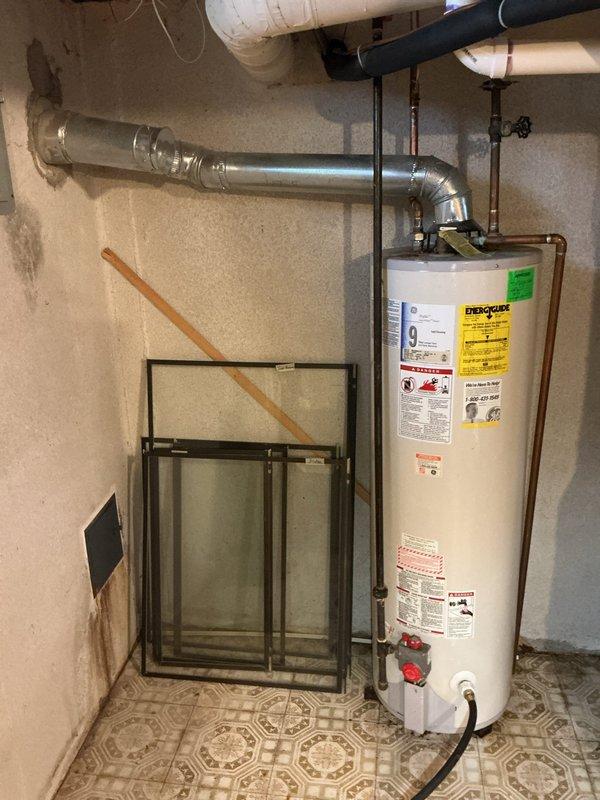 Installed a 40-gallon standard capacity tanked water heater in basement utility area, including all necessary copper supply line connections, pressure relief valve, and electrical hookup. Unit was properly positioned, leveled, and integrated with existing plumbing infrastructure, with all connections tested and verified operational upon completion.