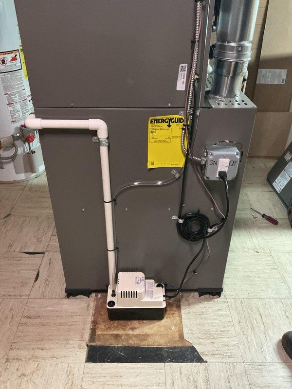 Completed full HVAC system replacement including installation of 70,000 BTU gas furnace with humidifier and chimney liner, paired with 2-ton air conditioning unit positioned at rear of structure. Installation included condensate pump with PVC drainage system, electrical disconnect reconnection, and all necessary conduit and wiring. Mechanical permit obtained for furnace-only installation per specifications, with system qualifying for utility rebate program.