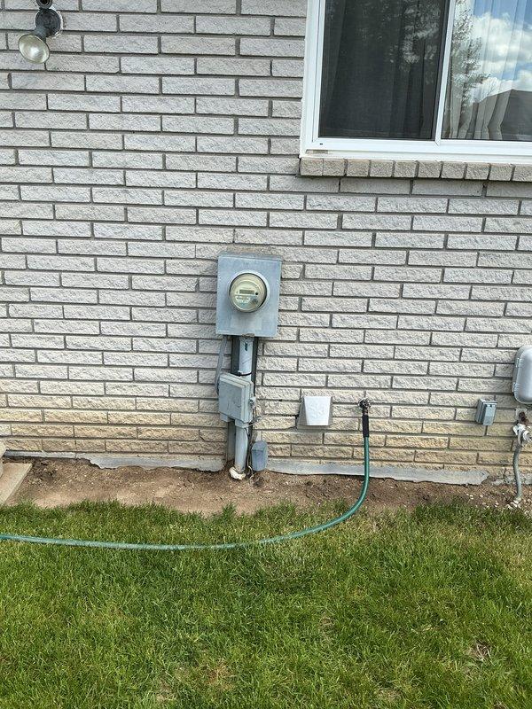 Conducted on-site evaluation for new whole home standby generator installation at residential property. Assessed existing electrical service panel, meter location, and natural gas supply infrastructure to determine optimal generator placement and connection requirements. Documented current utility configurations including electrical meter assembly with conduit routing and natural gas meter with multiple valve connections to develop comprehensive installation specifications for permanent standby generator system.