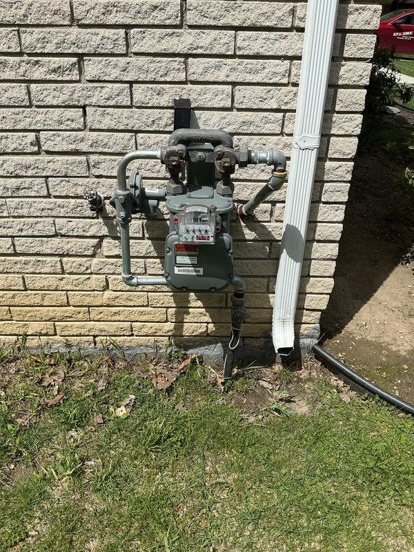 Conducted on-site evaluation for new whole home standby generator installation at residential property. Assessed existing electrical service panel, meter location, and natural gas supply infrastructure to determine optimal generator placement and connection requirements. Documented current utility configurations including electrical meter assembly with conduit routing and natural gas meter with multiple valve connections to develop comprehensive installation specifications for permanent standby generator system.