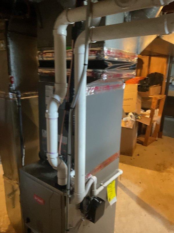 Completed full HVAC system installation including a 3-ton air conditioning unit with matching evaporator coil positioned in rear location, connected to existing furnace with new refrigerant lines and PVC condensate drainage. Installed 40-gallon hot water heater with reconnection of water and gas lines. All mechanical, plumbing, and air conditioning permits obtained and work performed to code specifications, with system tested and operational upon completion.