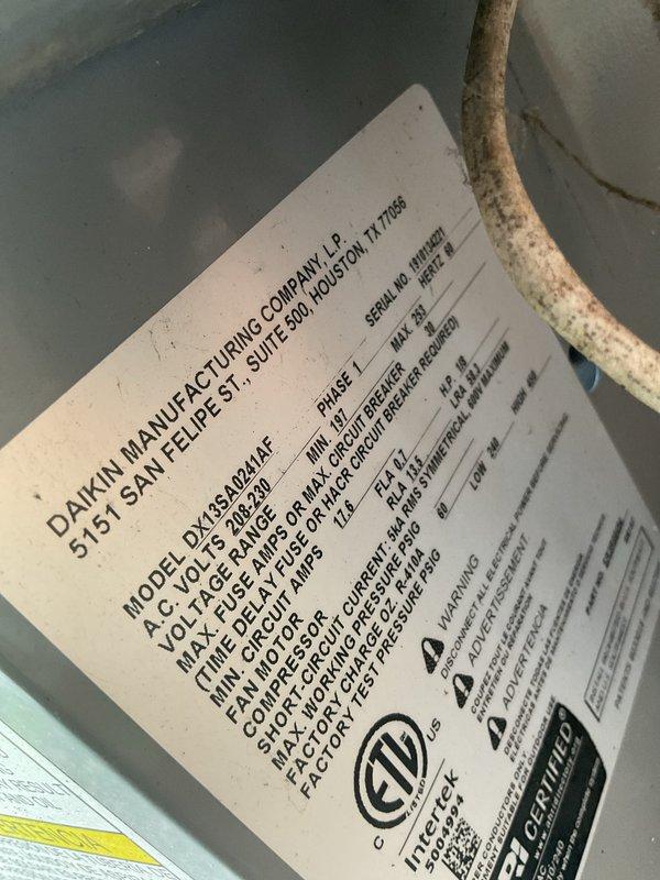 Completed Gold AC inspection on a 6-year-old Daikin DX13L2AF system with air handler located in basement. Unit was reported as non-operational at time of service. Performed comprehensive system evaluation including visual inspection of outdoor condenser unit, evaporator coil, and air filtration system. Documented equipment nameplate data and current operating specifications. Inspected air filter element showing pleated media in radial configuration. Captured photographic documentation of equipment condition and manufacturer identification for service records.