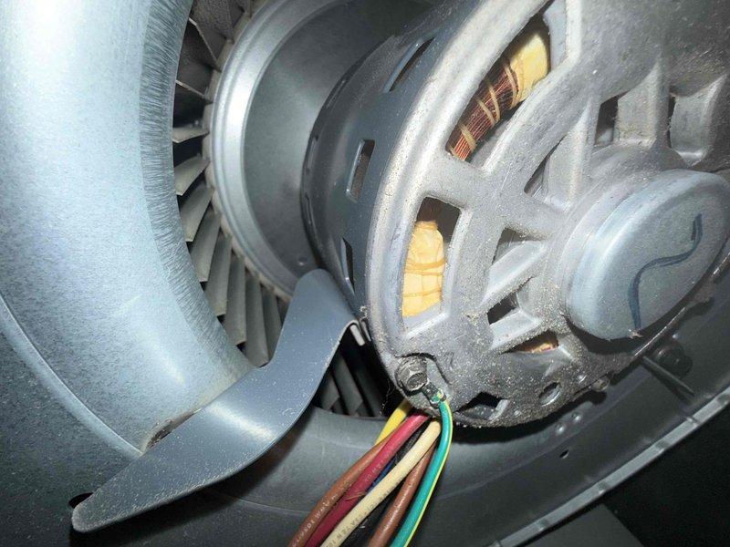 Responded to no heat call on 14-year-old Bryant furnace system. Upon inspection, discovered severely heat-damaged inducer motor connector with evident burn marks and discoloration on the plastic housing. The thermal damage to the electrical connector was causing intermittent or complete loss of power to the inducer motor assembly, preventing proper furnace operation and startup sequence. Documented the failed connector and motor assembly with photographic evidence showing the extent of heat damage and compromised electrical connection. Advised replacement of the inducer motor assembly due to the damaged connector and potential motor degradation from electrical arcing. System age and component condition indicate normal wear failure for equipment in this service life range. Provided recommendations for complete repair to restore heating functionality.