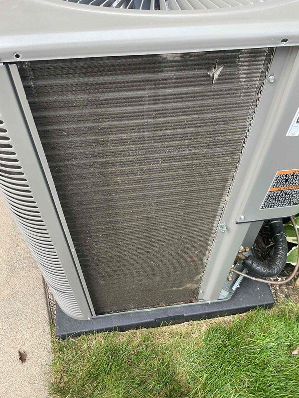 Completed annual tune-up and preventive maintenance on residential Lennox air conditioning system. Performed comprehensive inspection of outdoor condensing unit, noting significant dirt and debris accumulation on condenser coils which was affecting system efficiency. Cleaned condenser coils thoroughly to restore proper airflow and heat transfer capability. Verified proper operation of compressor, condenser fan motor, and all electrical components. Inspected refrigerant lines for leaks and proper insulation. System tested and confirmed operating within manufacturer specifications following service completion.