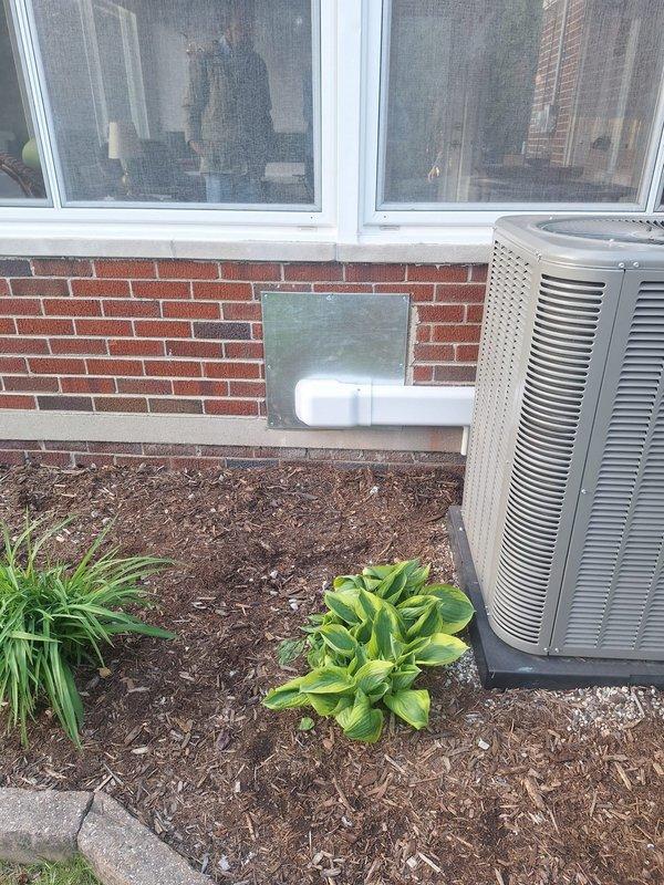 Completed installation of Daikin mini-split system in rear yard area of residential property. Mounted outdoor condenser unit on brick exterior wall using white mounting brackets and installed indoor console unit. Ran new dedicated electrical circuit to support the system, with mechanical, electrical, and mini-split permits requested and processed. Unit positioned on concrete pad in landscaped area, with all refrigerant lines and electrical connections properly secured and tested for optimal operation.