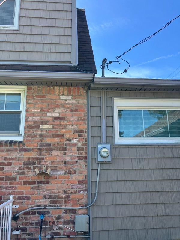 Conducted full system estimate for HVAC installation in attached garage being converted to living space. Assessed existing outdoor Bryant condenser unit and electrical infrastructure, photographed current system configuration including meter location and conduit routing on brick and vinyl exterior, and evaluated structural considerations for extending heating and cooling capacity to the new living area.