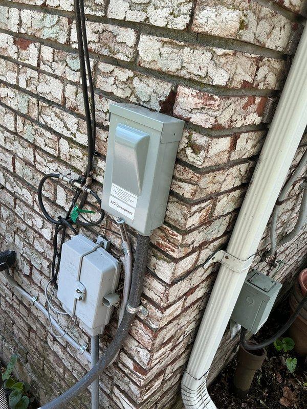 Completed comprehensive NSP AC inspection on 5-year-old basement coil system. Inspected outdoor condenser unit and confirmed proper fan operation, assessed exterior electrical connections and utility installations, and verified system functionality. All equipment operating within normal parameters with no immediate service needs identified.