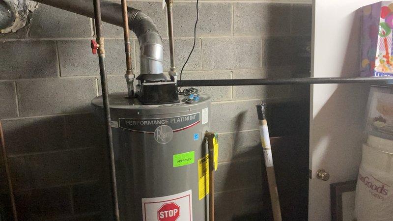 Replaced corroded anode rod on Performance Platinum water heater to restore corrosion protection and extend tank life. Performed complete tank flush to remove sediment buildup, improving heating efficiency and system performance.