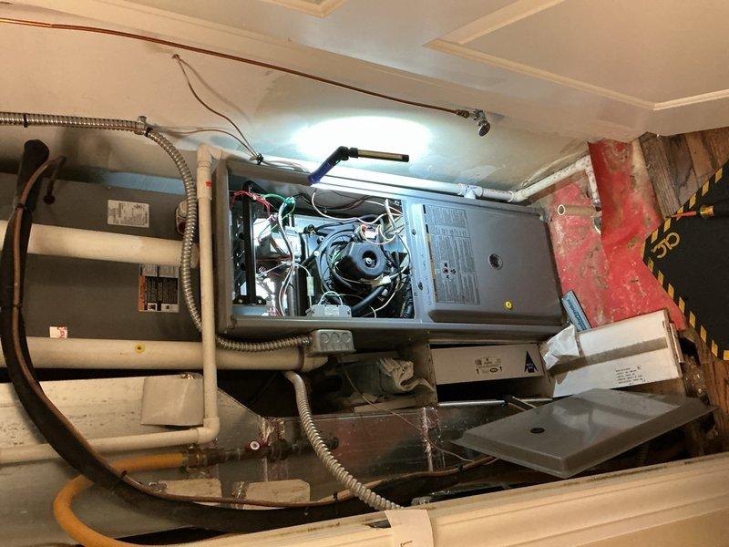 Completed comprehensive Gold AC Inspection and tune-up service on two 14-year-old air conditioning systems—one basement unit and one upstairs unit. Performed thorough system evaluation on both indoor air handlers and outdoor condensers, including inspection of blower motor assemblies, fan components, electrical connections, and refrigerant lines. Removed access panels to examine internal components, verified proper operation of all mechanical systems, and checked condensate drainage. Inspected outdoor condenser units positioned on brick patio area, evaluating fan grilles, protective mesh housing, refrigerant line connections, and electrical conduit routing. Both systems demonstrated normal operational parameters for units of this age and received preventive maintenance to ensure continued reliable performance throughout the cooling season.