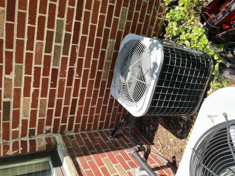 Completed comprehensive Gold AC Inspection and tune-up service on two 14-year-old air conditioning systems—one basement unit and one upstairs unit. Performed thorough system evaluation on both indoor air handlers and outdoor condensers, including inspection of blower motor assemblies, fan components, electrical connections, and refrigerant lines. Removed access panels to examine internal components, verified proper operation of all mechanical systems, and checked condensate drainage. Inspected outdoor condenser units positioned on brick patio area, evaluating fan grilles, protective mesh housing, refrigerant line connections, and electrical conduit routing. Both systems demonstrated normal operational parameters for units of this age and received preventive maintenance to ensure continued reliable performance throughout the cooling season.